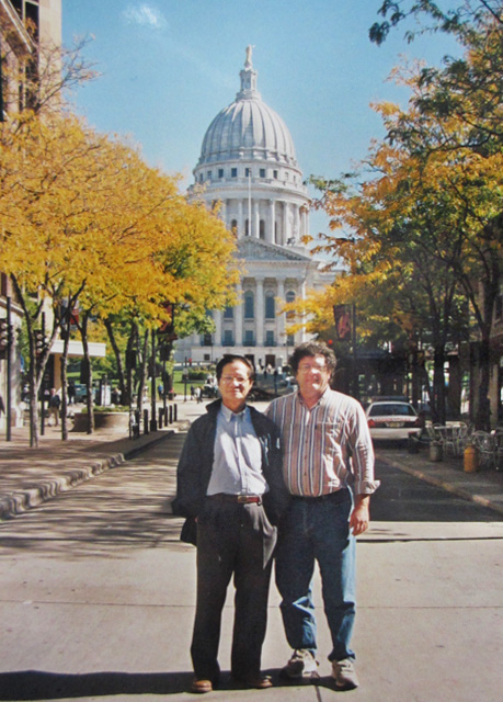 Trần Văn Thủy and Mike in front of a mid-western American state capitol.